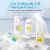 Image showcasing four different types of XIRAN sunscreen products on a sandy surface with a background of ocean, promoting daily brightening and skin tone correction.