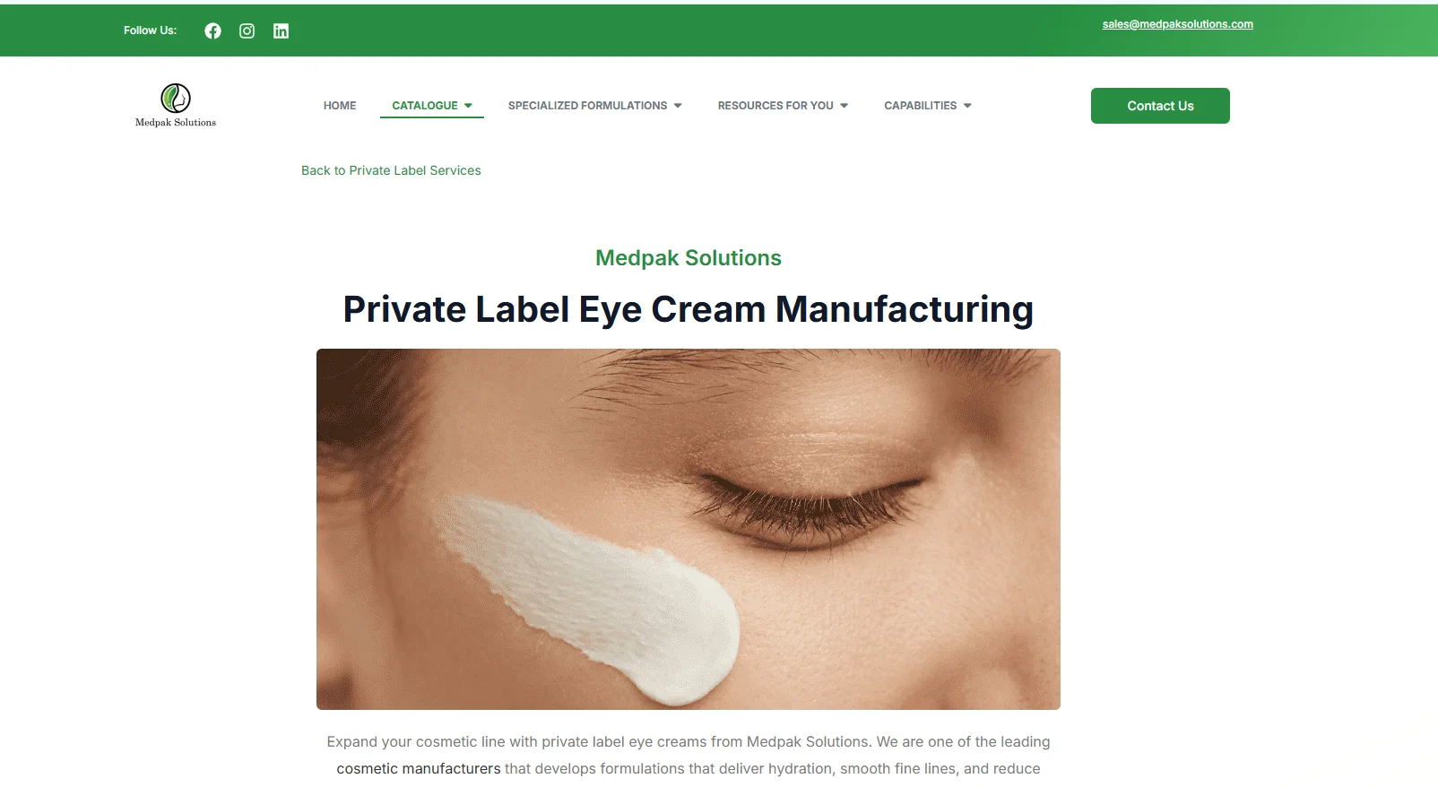 Skincare cream jar surrounded by lavender flowers.